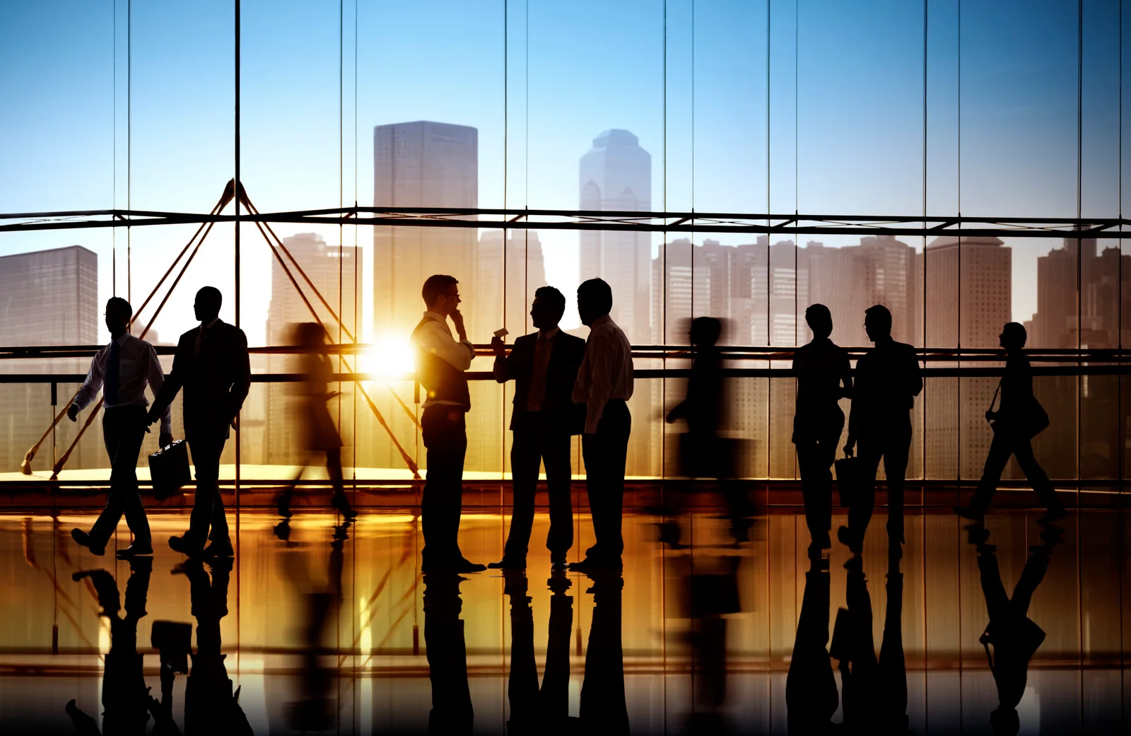 Business professionals collaborating in a modern office, representing teamwork, unified leadership, and single-point accountability.